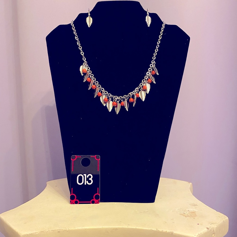 A very beautiful unique necklace and earring set. Orange beads & silver leaves.